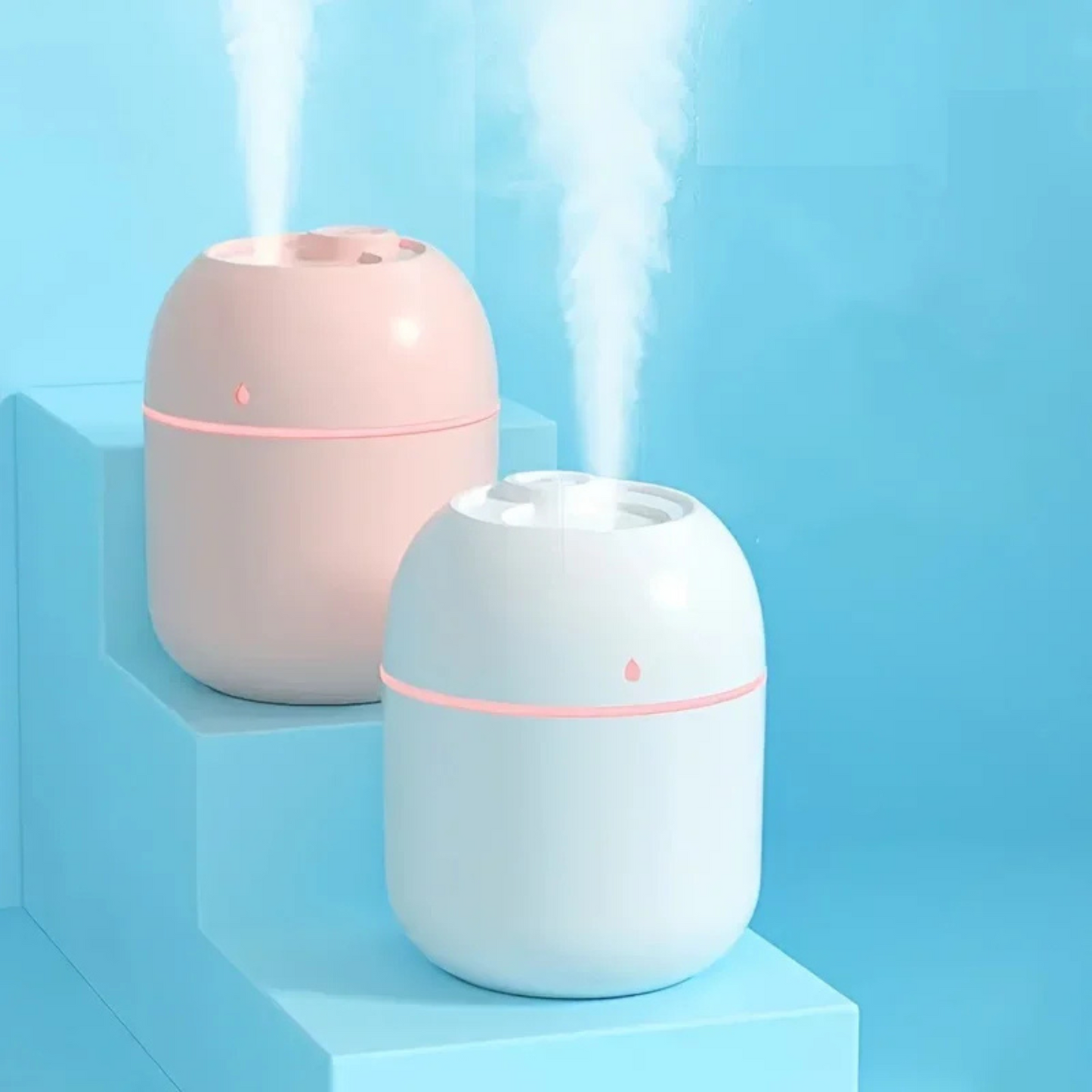 Diffuseurs Capsulea blanc et rose avec lumière veilleuse en ambiance douce